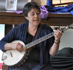 Lui playing banjo at a Hilltown Music Together class-photo by Debbie Lusignan