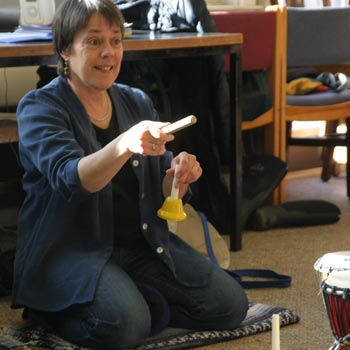 Lui directing a song on bells